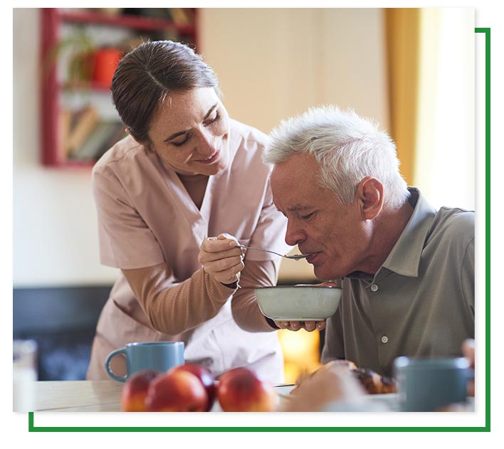 Care giver providing nurishment Care giver providing nurishment